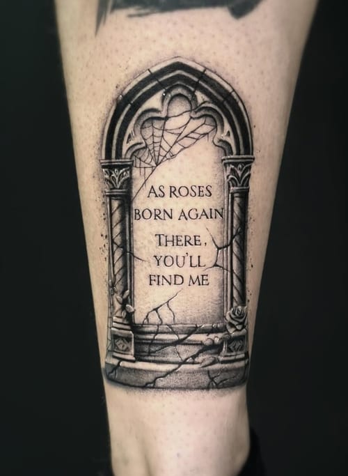 A black and grey tattoo on the calf featuring a realistic stone archway with a quote inscribed on it, surrounded by detailed stonework and cracks — by Jian Liang, los angeles