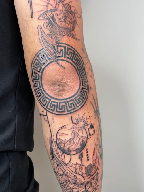 linework geometric circle with mountain landscape tattoo — by Vince Espinoza, los angeles