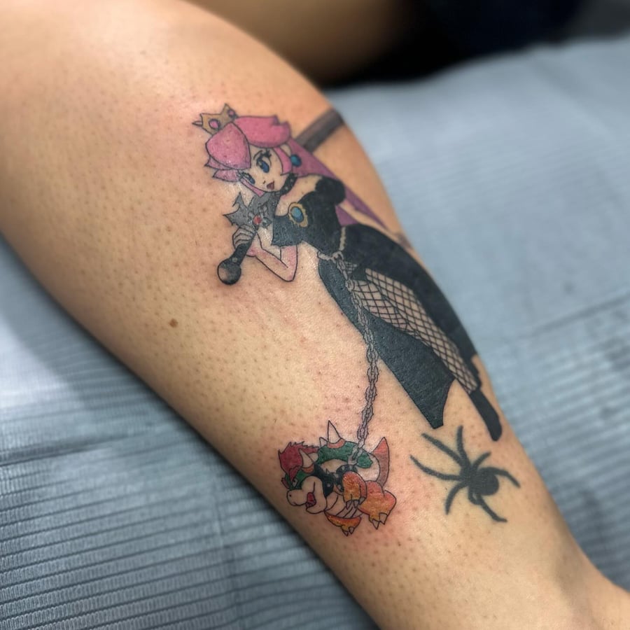 A colorful anime-style character with a sword and chain on the leg, featuring blackwork and a spider design — by Maddie Ramirez, los angeles
