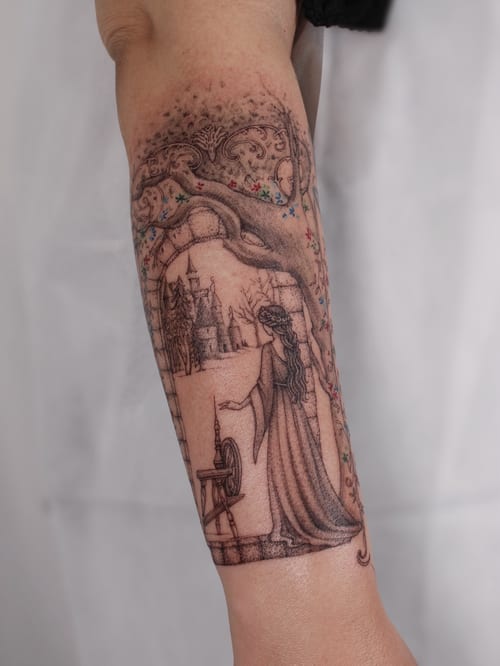 A delicate fine line tattoo of a woman with a spinning wheel, featuring mythological elements, on the forearm with mixed color accents — by Melanie Benoit, los angeles