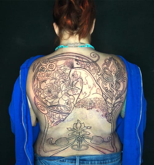 A detailed linework tattoo of a peacock with floral elements covering the full back, featuring ornamental designs — by Sandra Price, los angeles