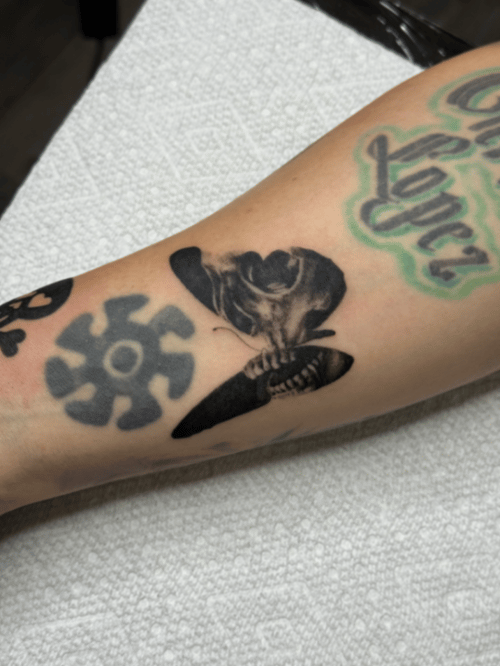 black & grey skull with butterfly tattoo — by lunayflorestattoo, los angeles
