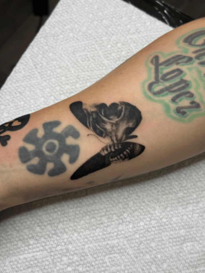 black & grey skull with butterfly tattoo — by lunayflorestattoo, los angeles