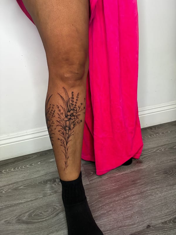 fine line botanical bouquet with lavender and wildflowers on the calf — by edgar armas rodriguez, los angeles