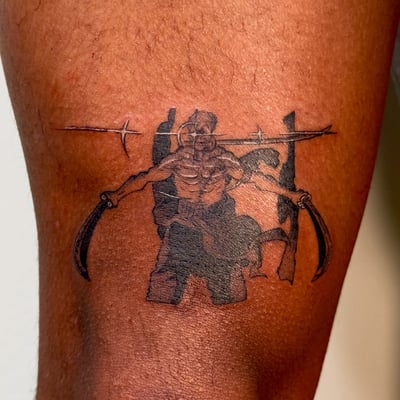A bold blackwork tattoo of a warrior holding swords on the leg, featuring strong graphic lines and shading — by NJ TATTOOZ, los angeles