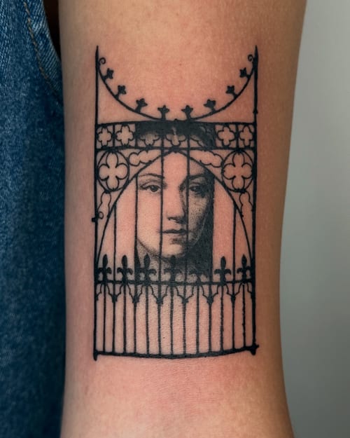 blackwork face behind gate tattoo — by Level tattoo, los angeles