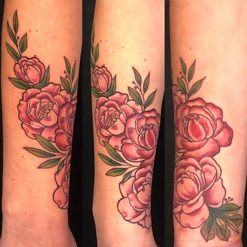 A colorful neo-traditional flower bouquet tattoo on the forearm with pink and green hues — by Sandra Price, los angeles