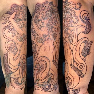 A bold black linework tattoo of a woman with tentacles and a skull on the forearm — by Sandra Price, los angeles