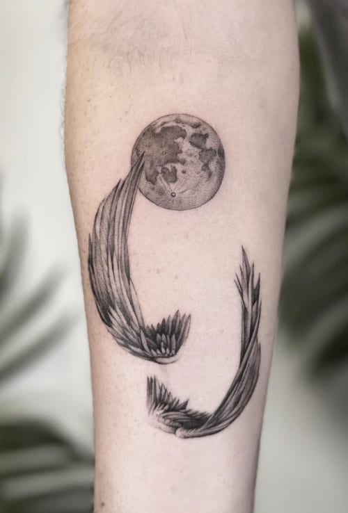 A fine line black and grey tattoo of two koi fish swimming around a moon on the forearm, featuring delicate linework and shading — by Jian Liang, los angeles