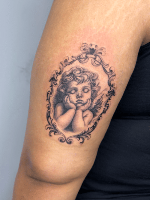realism cherub tattoo — by lunayflorestattoo, los angeles
