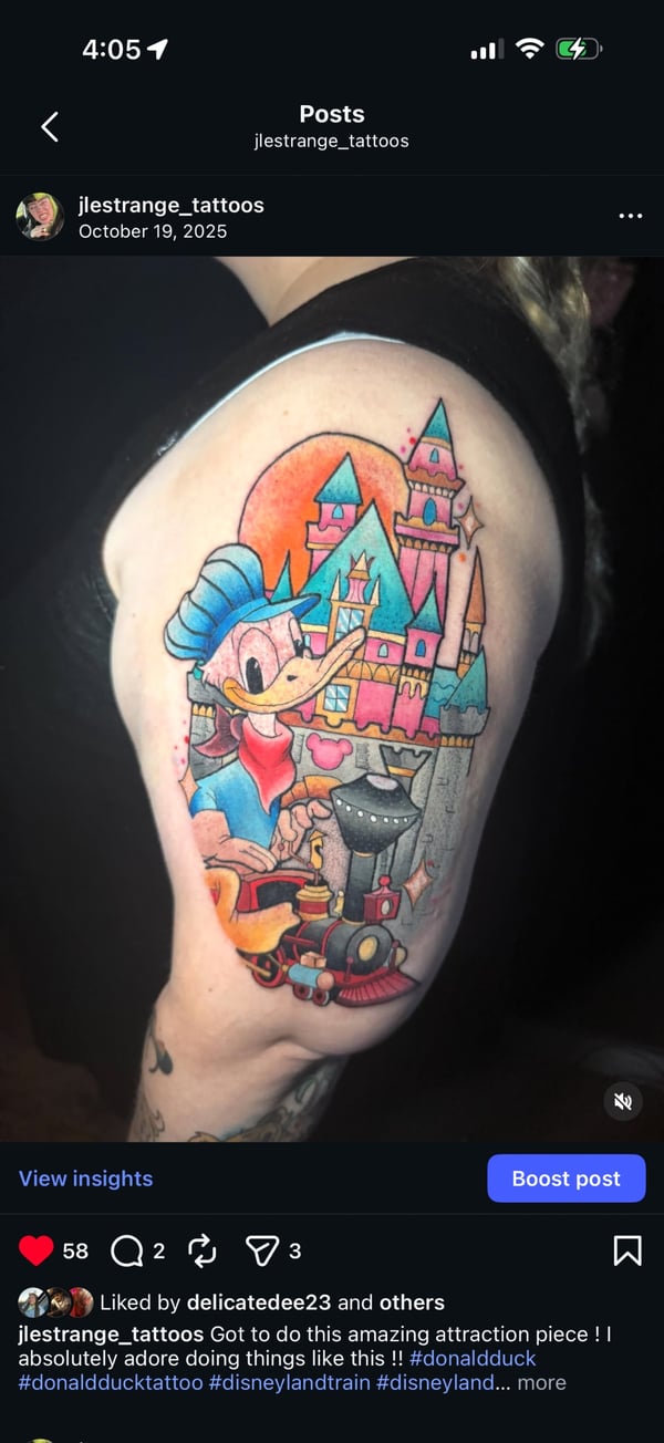 A colorful neo-traditional tattoo of Donald Duck with a whimsical castle on the upper arm, featuring bold outlines and vibrant colors — by Jessica Linden, riverside, ca