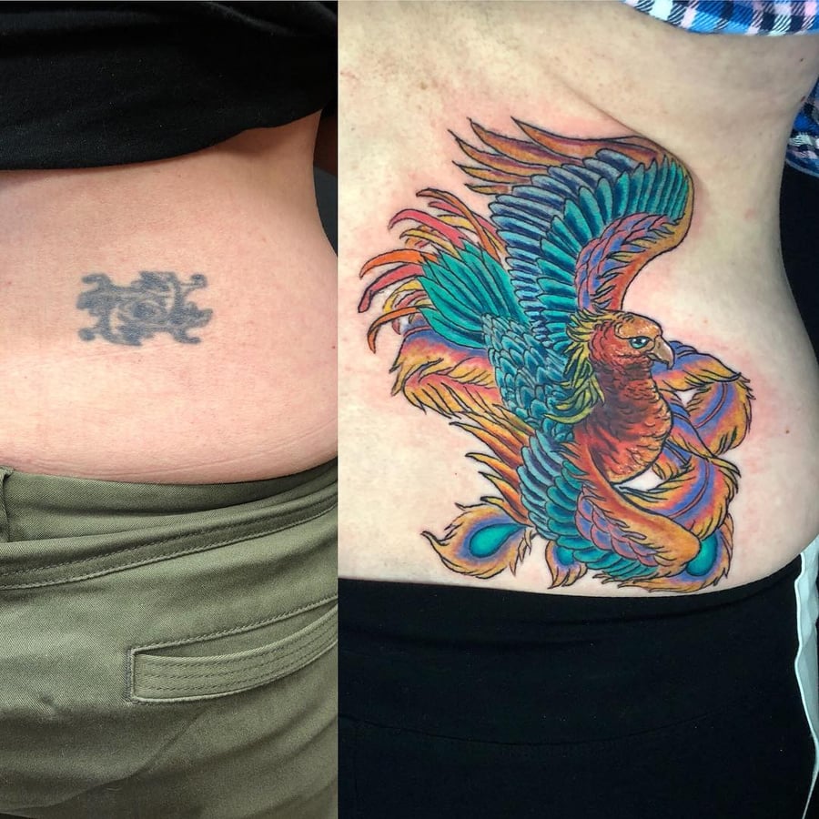 A vibrant and bold neo-traditional phoenix tattoo on the rib, featuring colorful feathers and dynamic lines — by Sandra Price, los angeles
