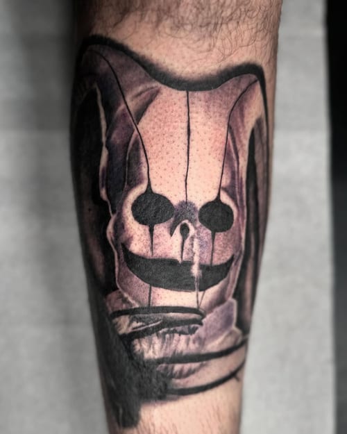A black and grey Luna Ghost tattoo from Scooby-Doo on the forearm, featuring a dark and graphic style — by Maddie Ramirez, los angeles