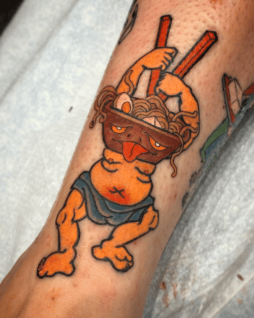 A colorful New School tattoo on the forearm depicting a cartoonish character with a bowl of noodles on its head, featuring exaggerated features and vibrant colors — by tyler_whitlock, los angeles