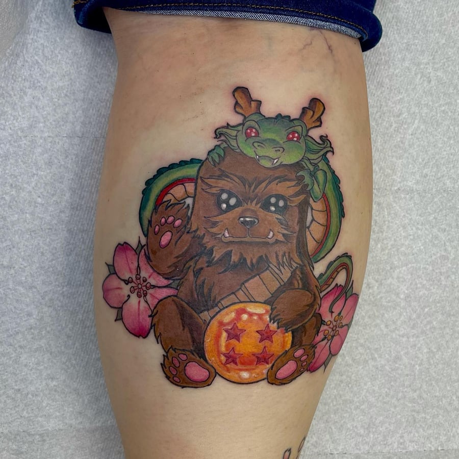 A colorful new school tattoo of a cute creature with a dragon and flowers on the leg, featuring bold lines and vibrant colors — by Sandra Price, los angeles