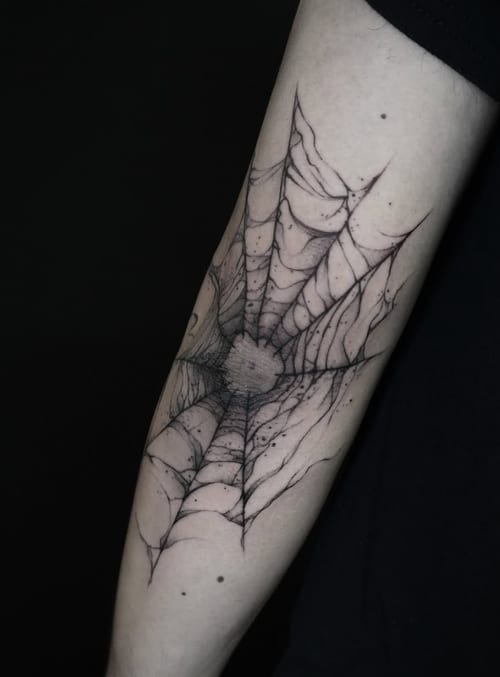 A black and grey linework tattoo of a spider web on the forearm, featuring intricate details and a minimalist style — by Jian Liang, los angeles