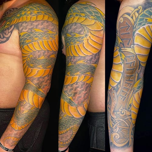 A bold and colorful Japanese-style snake tattoo with geometric patterns covering the full sleeve — by Sandra Price, los angeles
