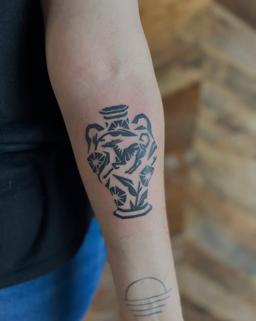 A bold blackwork geometric vase tattoo on the forearm with intricate patterns — by Dylan Aiello, los angeles