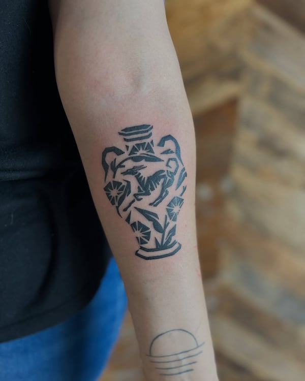 A bold blackwork geometric vase tattoo on the forearm with intricate patterns — by Dylan Aiello, los angeles
