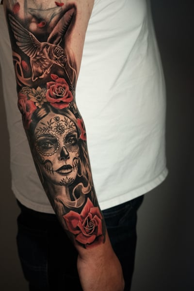 realism sugar skull with roses tattoo — by Johnny Ayala, los angeles