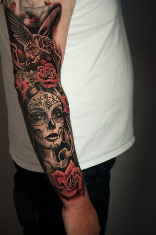realism sugar skull with roses tattoo — by Johnny Ayala, los angeles