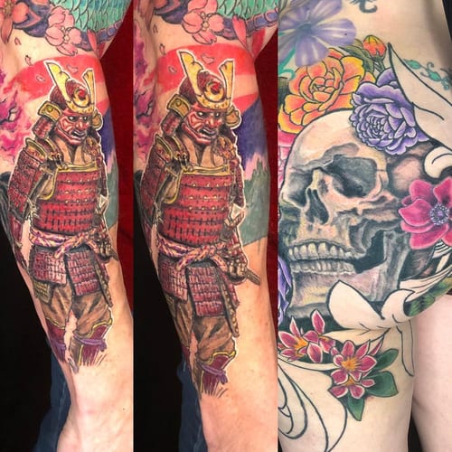 A colorful Japanese-style tattoo featuring a samurai and a skull with flowers on the arm, showcasing bold and ornate details — by Sandra Price, los angeles
