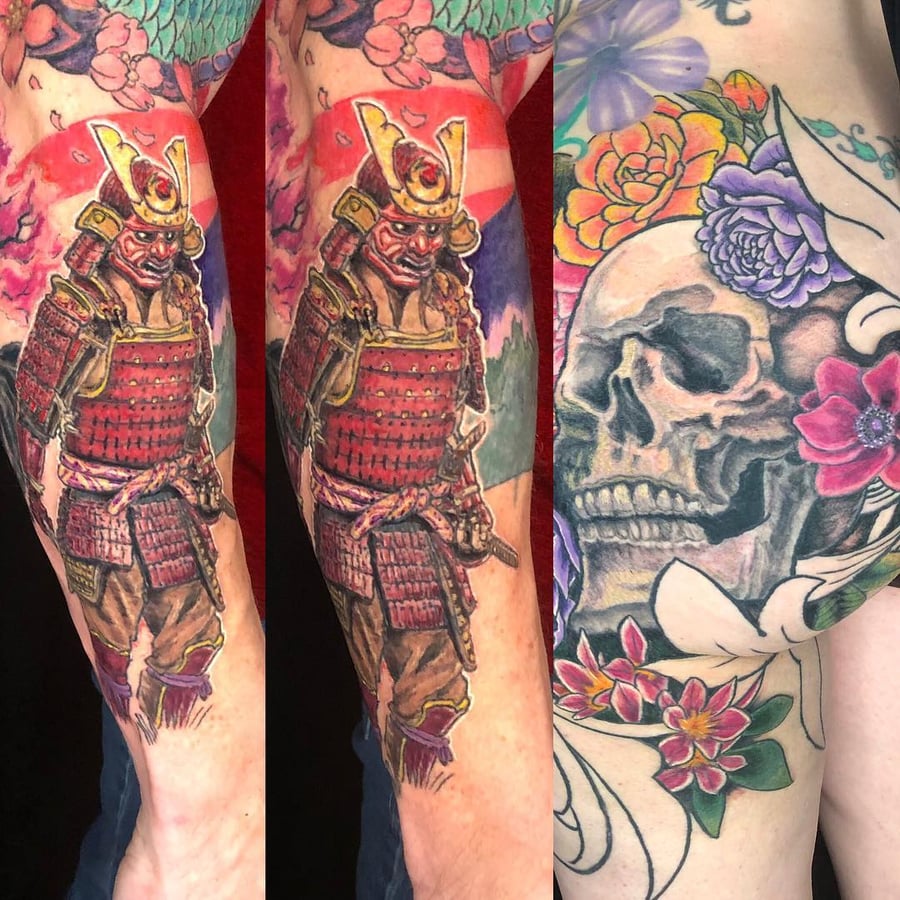 A colorful Japanese-style tattoo featuring a samurai and a skull with flowers on the arm, showcasing bold and ornate details — by Sandra Price, los angeles