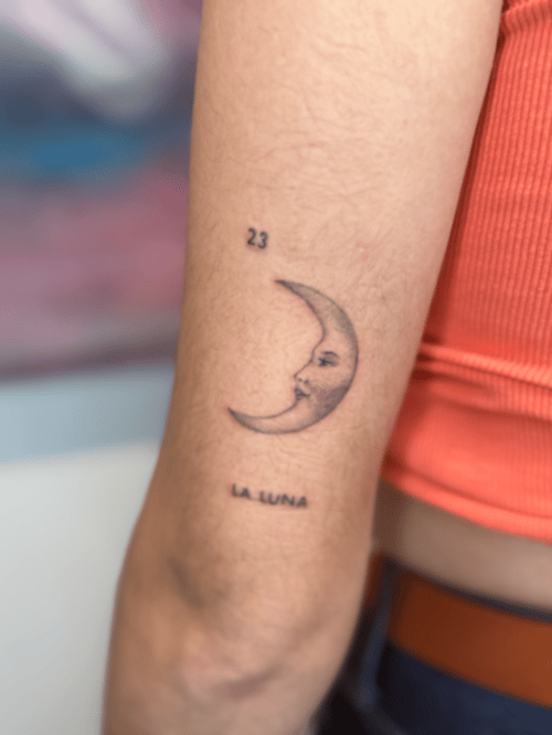 minimalist crescent moon with face tattoo — by Samantha Wilks, los angeles