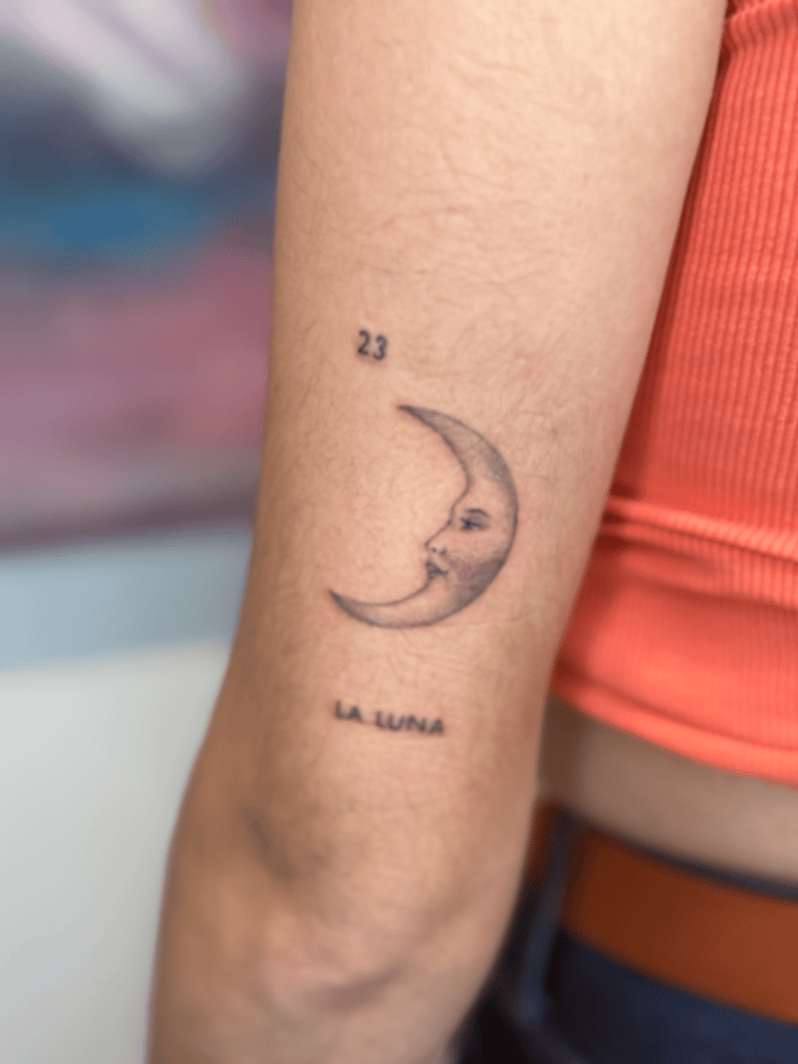 minimalist crescent moon with face tattoo — by Samantha Wilks, los angeles