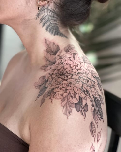 A delicate black and grey chrysanthemum tattoo on the shoulder extending to the neck with ornate floral details — by Melanie Benoit, los angeles
