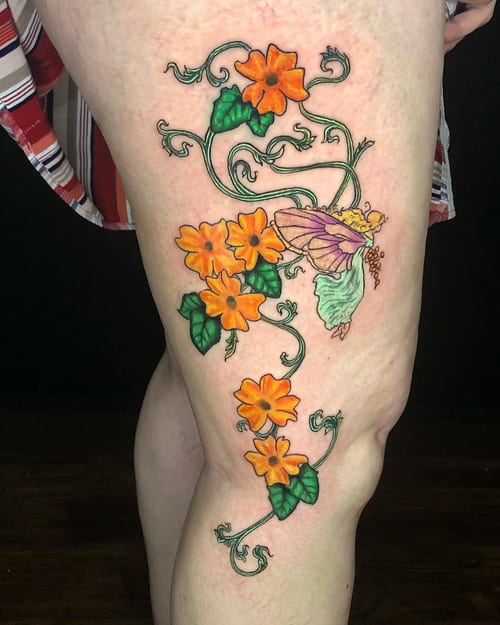 A colorful neo-traditional tattoo of orange flowers and a butterfly on the thigh, featuring delicate linework and vibrant colors — by Sandra Price, los angeles