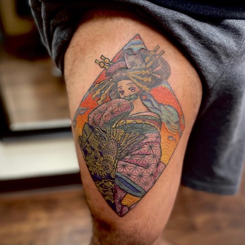 A colorful Japanese-style tattoo of a geisha holding a fan on the thigh, featuring intricate patterns and vibrant colors — by Sandra Price, los angeles