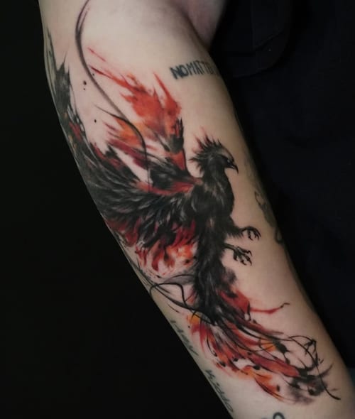 A dynamic watercolor tattoo of a phoenix on the forearm, featuring black ink with vibrant red and orange splashes, creating a fiery effect — by Jian Liang, los angeles