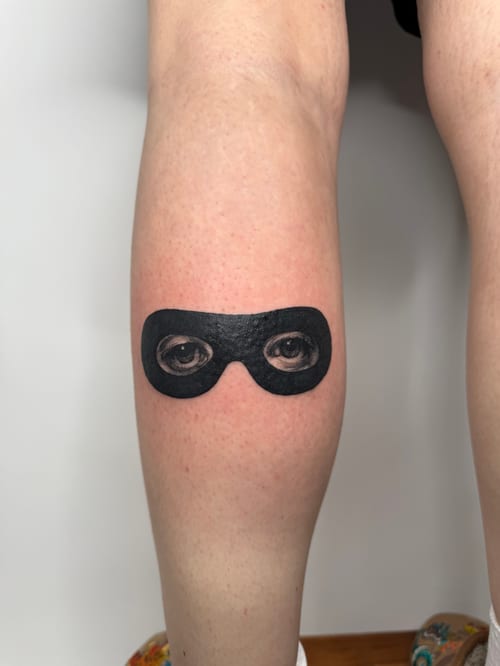 realism eyes with mask tattoo — by Level tattoo, los angeles