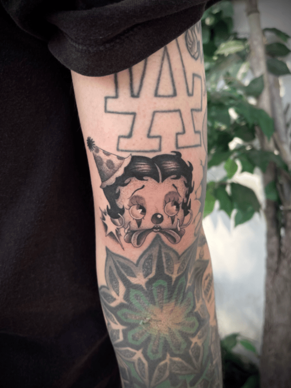 blackwork cartoon dog with party hat tattoo — by Engram, tarzana, ca