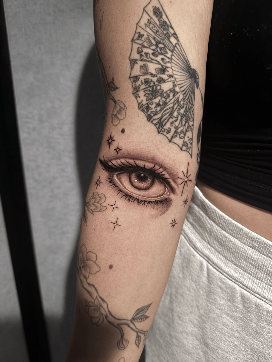 black & grey eye with decorative elements tattoo — by Shelby Bianco, los angeles