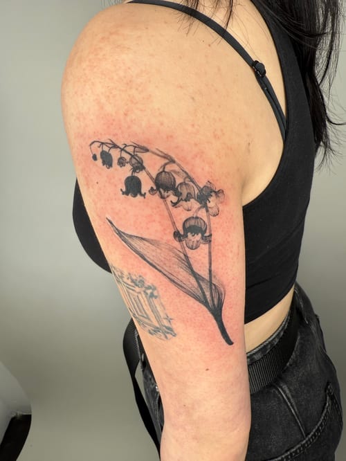 blackwork lily of the valley tattoo — by Level tattoo, los angeles