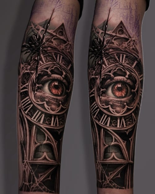 A detailed black and grey tattoo of an eye surrounded by a clock face and spider on the forearm, featuring realistic shading and intricate details — by Vladimir Kozachenko, los angeles