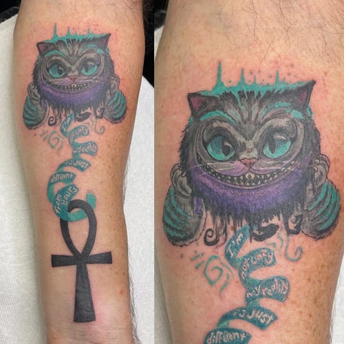 A colorful illustrative tattoo of the Cheshire Cat with whimsical script on the forearm — by Sandra Price, los angeles
