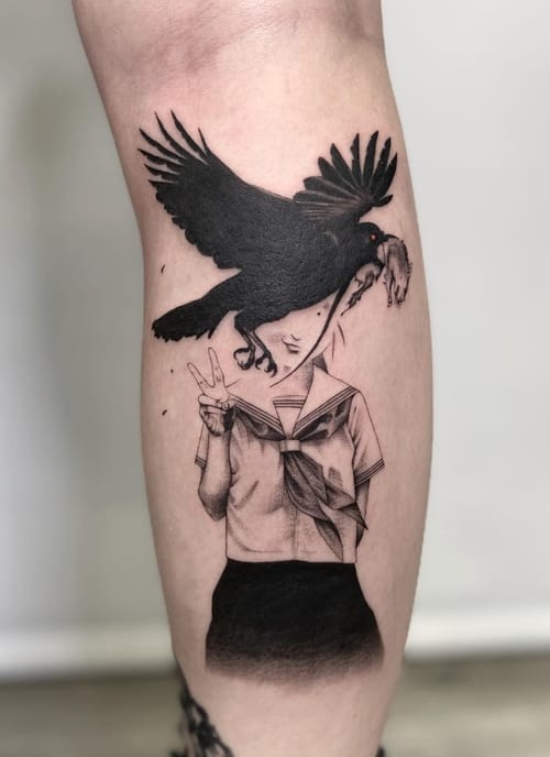 A black and grey illustrative tattoo on the calf depicting a woman in a school uniform with a large bird obscuring her face, rendered in a bold blackwork style — by Jian Liang, los angeles