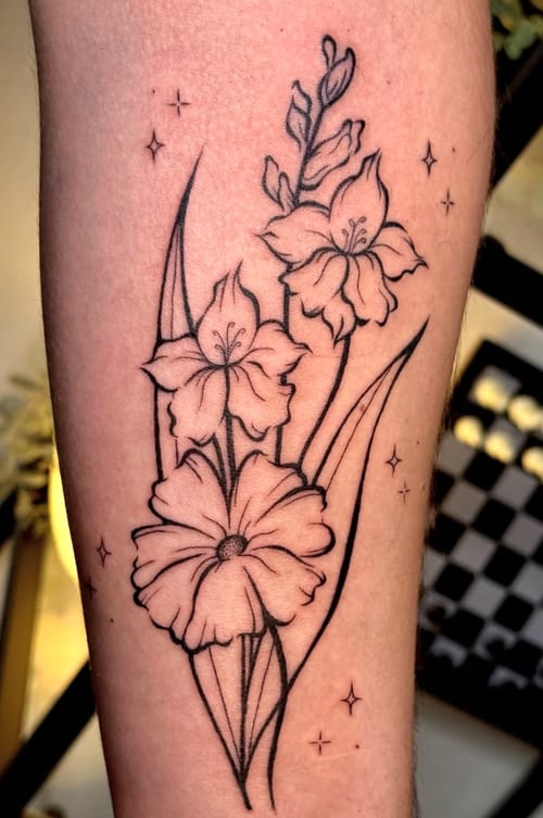 A fine line black and grey tattoo of flowers on the forearm, featuring delicate outlines and subtle shading — by NJ TATTOOZ, los angeles