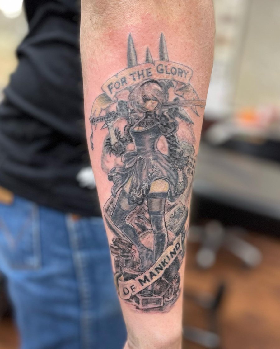 A bold black and grey tattoo of an anime character with a sword on the forearm, featuring a graphic style and a quote — by Sandra Price, los angeles