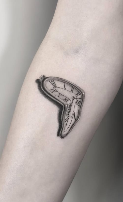 A black and grey surrealism tattoo of a melting clock on the forearm, inspired by Salvador Dali's style, with fine line details — by Jian Liang, los angeles