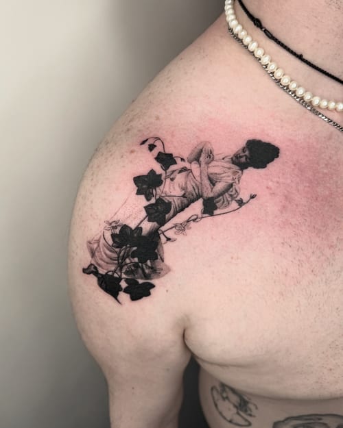 black & grey woman with ivy tattoo — by Level tattoo, los angeles