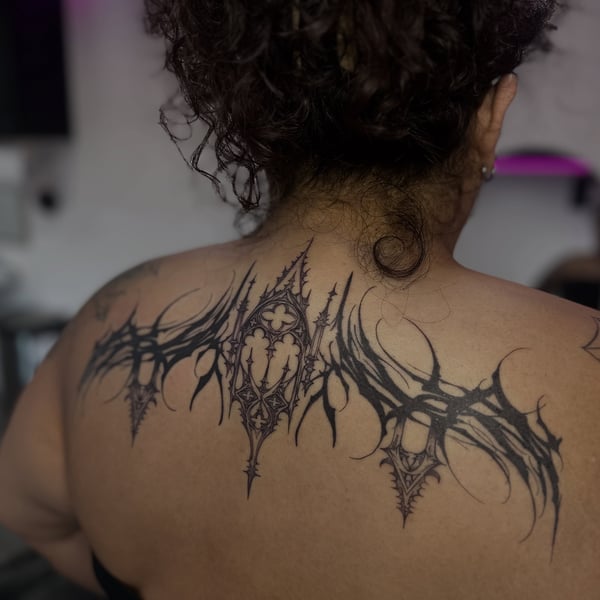 A dark and ornate gothic ornamental design tattooed on the back — by Maddie Ramirez, palm desert, ca