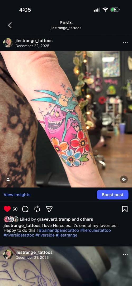 A colorful Neo-Traditional tattoo on the forearm featuring a cartoonish creature with flowers, characterized by bold outlines and vibrant colors — by Jessica Linden, los angeles