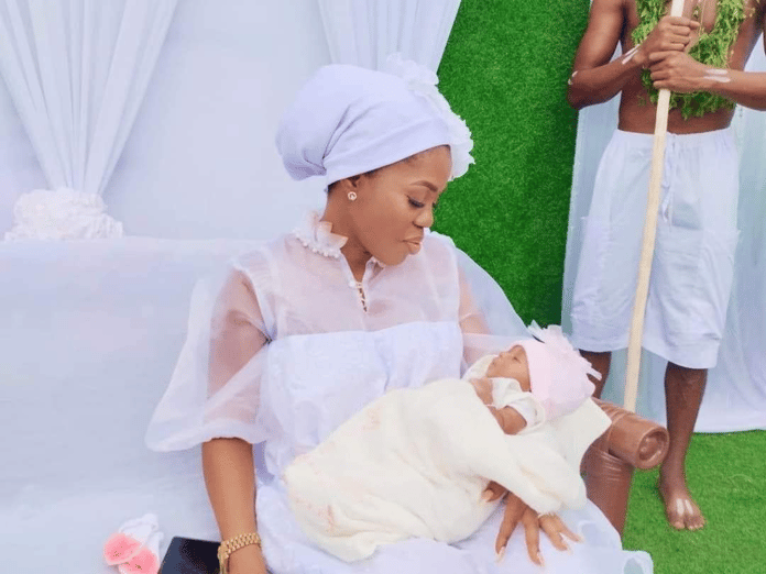 Mzbel celebrates her daughter's arrival with a traditional Ga naming ceremony