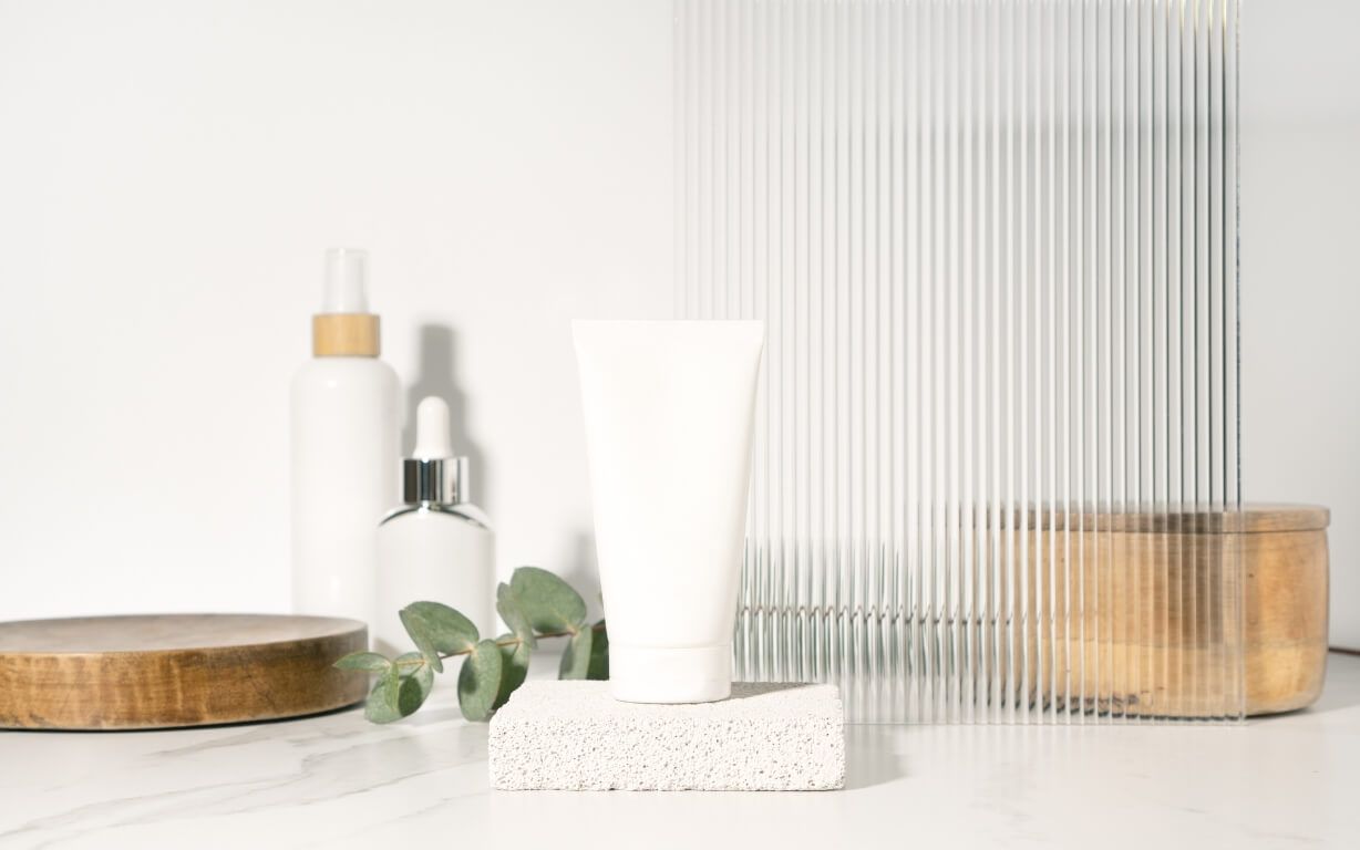 White tube mockup for presenting cosmetic products on a bathroom table.jpg