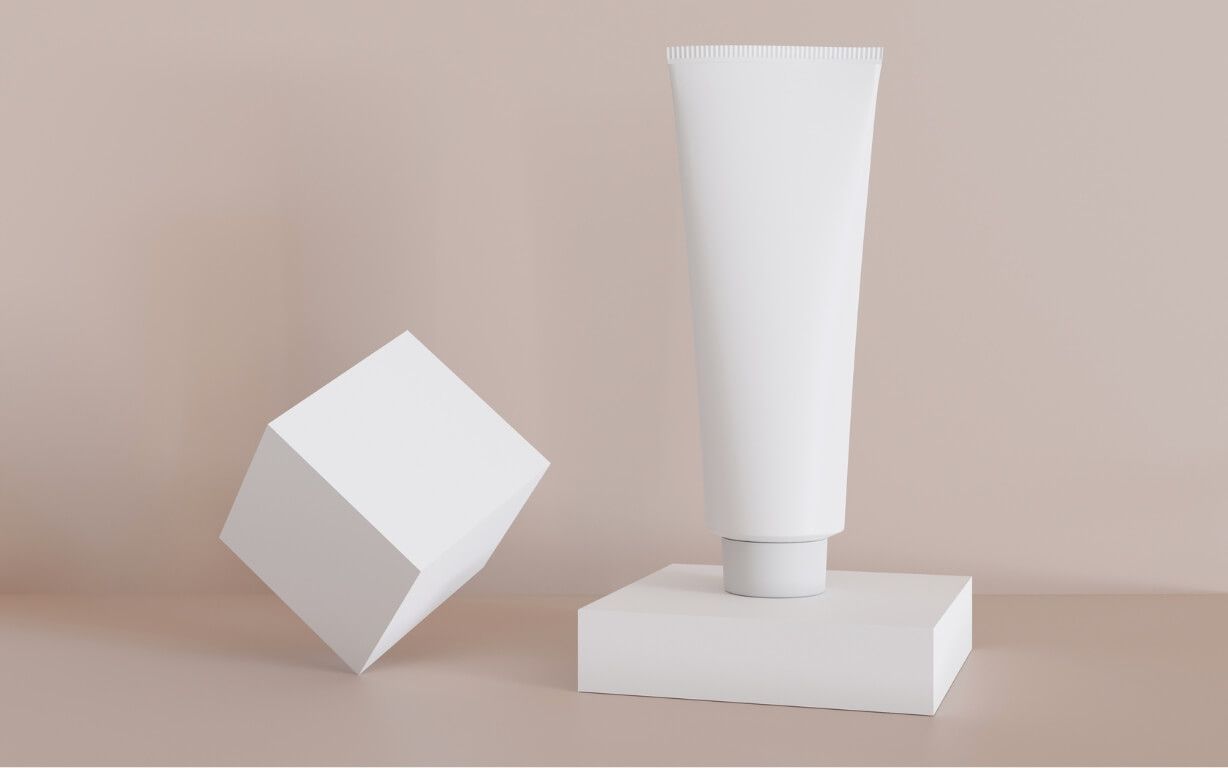 Blank, unbranded, white cosmetic cream tube with simple geometric shapes.jpg