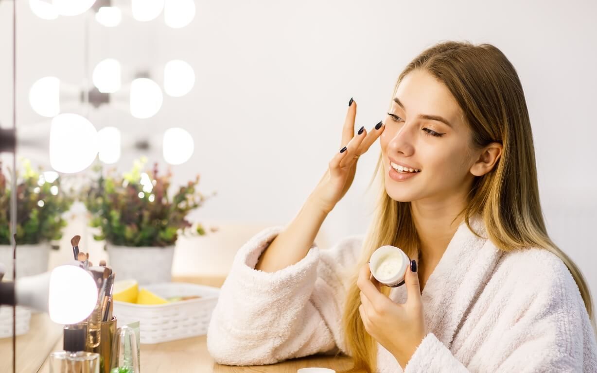 Woman applying skincare cream.jpg